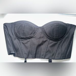 Black cropped corset with lace up back. NEVER WORN